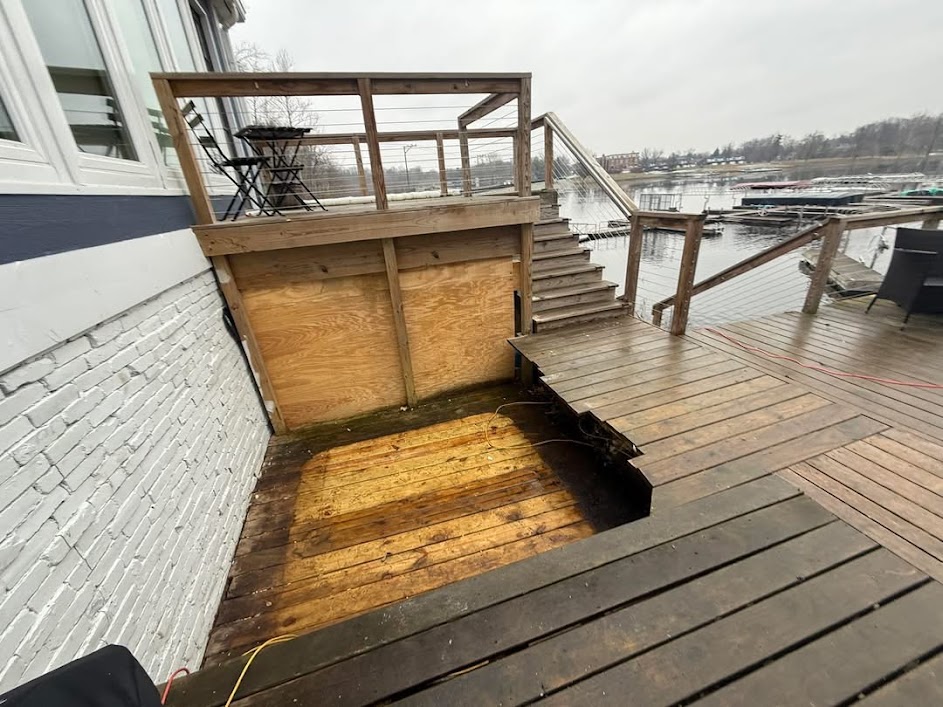 After hot tub removal — cleared lakeside deck ready for refinishing